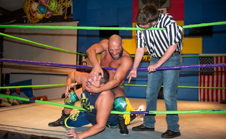 The main event card at the Rodney Hix wrestling event on Saturday featured Wild Billy Buck and Sal Rinauro, with adversary Tristan Michaels as the referee. ZACH TAYLOR/Staff