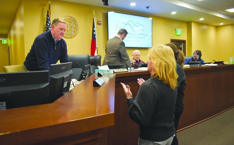 As the board exits the room for executive session, Interim County Manager Tim Sims assures Reign Elite Owner Neva Daniels that safety is the county’s top concern in repairs to the gymnastics facility. Samantha Sinclair/Staff