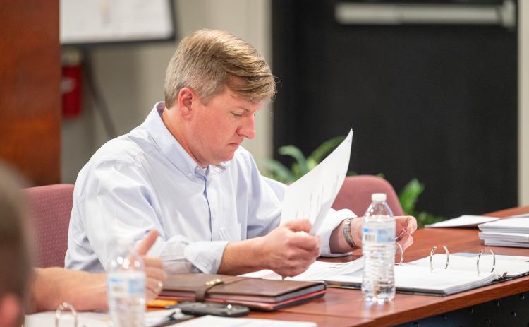 Demorest Mayor Jerry Harkness reviews paperwork on the grants. ZACH TAYLOR/Staff
