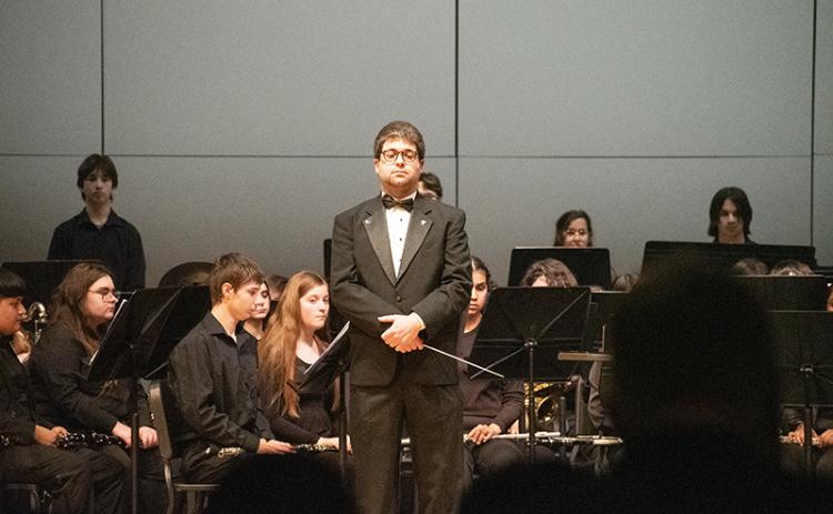 Habersham Central Band Director Jacob Weinstein waits for the performance evaluators to make their comments before proceeding with the practice performance. HANNAH CAUDELL/Staff