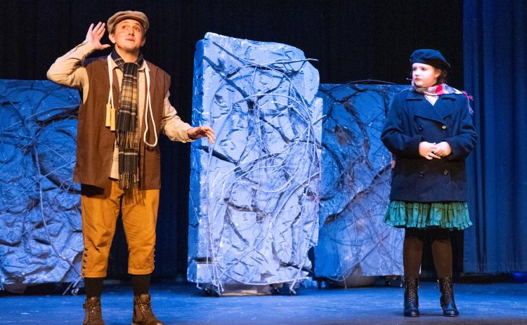 Jonas Corbin (left) plays Dickon in the show. Emma Johnson (right) stars in her first lead role as Mary Lennox. Dickon and Lennox are seen listening to the robin on top of the garden’s wall. ZACH TAYLOR/Staff