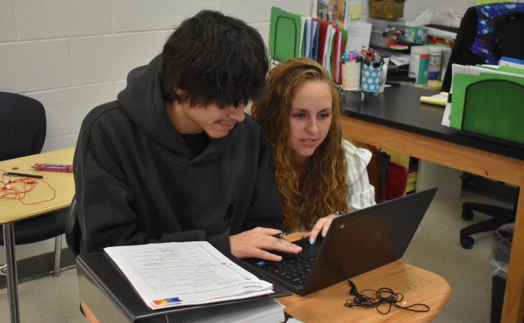 Habersham Success Academy Teacher Candace Carver (right) helps one of her students, Alejandro Rodriguez (left) on an early morning at the Habersham Success Academy. Carver is this year’s Teacher of the Year for the Habersham County School district, an honor she says is humbling. SAMANTHA SINCLAIR/Staff
