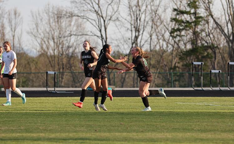 TIN POFFENBERGER/Special Lady Indians’ players (from left) Ryleigh Wilson, Lizzie Huebner and Miah Gragg celebrate a TFS goal earlier this spring.