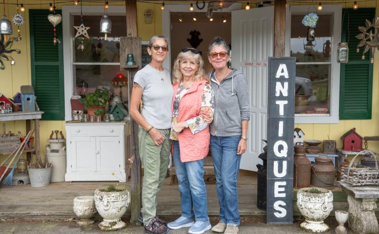 Sarah, Connie and Lori Walters stand in front of the cozy building just south of the barn. ZACH TAYLOR/Staff