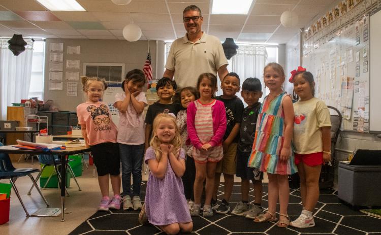 Hazel Grove Elementary School Principal Dr. Tim Goss visits a group of students during the school day, all of whom were excited to see him walk through the door. Goss has spent nine nonconsecutive years at Hazel Grove, returning in 2022 to serve as the school’s principal before retirement. HANNAH CAUDELL/Staff