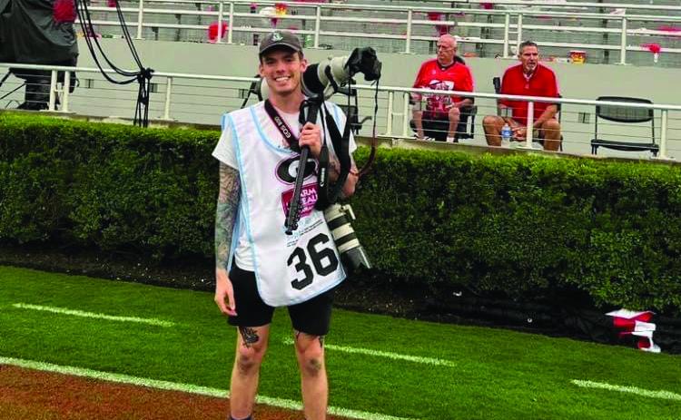 UBMITTED Landen Todd covers a football game for The Red & Black.