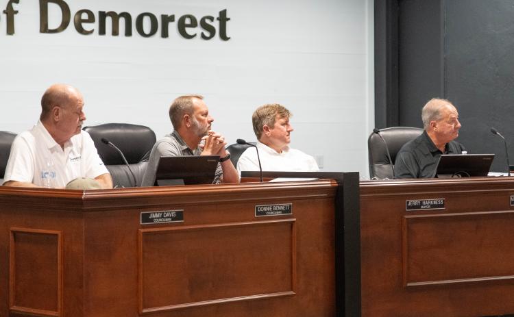 (Left to right) Councilman Jimmy Davis, Councilman Donnie Bennett, Mayor Jerry Harkness, and City Manager Mark Musselwhite listen to the new zoning ordinance amendments in the special called meeting on Monday. ZACH TAYLOR/Staff