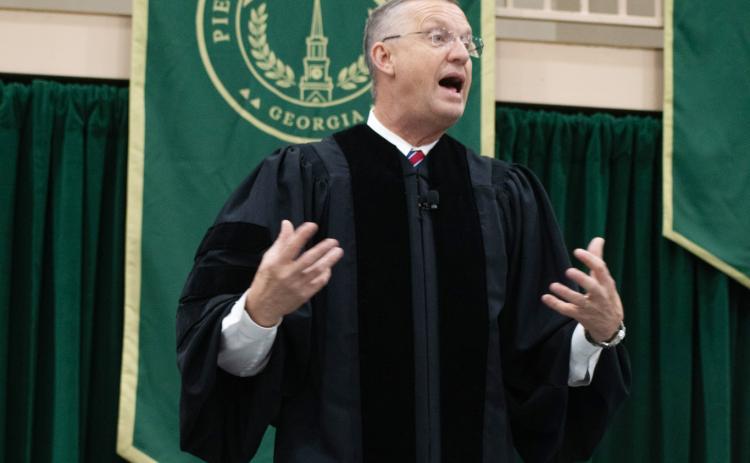 U.S. Secretary of Veteran Affairs Doug Collins addresses the Piedmont’s Class of 2025 with a simple message: be curious, because life may take you down a road that’s unexpected. HANNAH CAUDELL/Staff