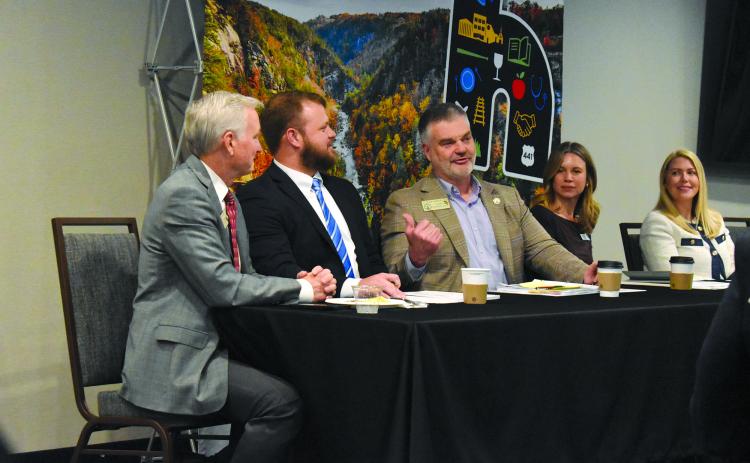 Rep. Victor Anderson explains how he and Sen. Bo Hatchett and Rep. Chris Erwin work together as a team during the Post-Legislative Breakfast panel discussion as Nancy Palmer of the Georgia Chamber of Commerce listens. Samantha Sinclair/Staff