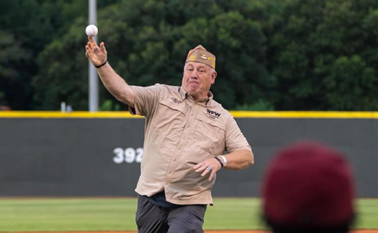 Georgia Department of Veterans of Foreign Wars Commander Bill Miles throws the first pitch at the Macon Bacon home game on Tuesday. (Lena Shoemaker/Macon Bacon)