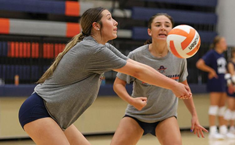 Habersham Central High School’s volleyball team gets in some practice on Tuesday, July 8. Above, Miley Ragan positions herself for a pass. (Landen Todd/Staff)