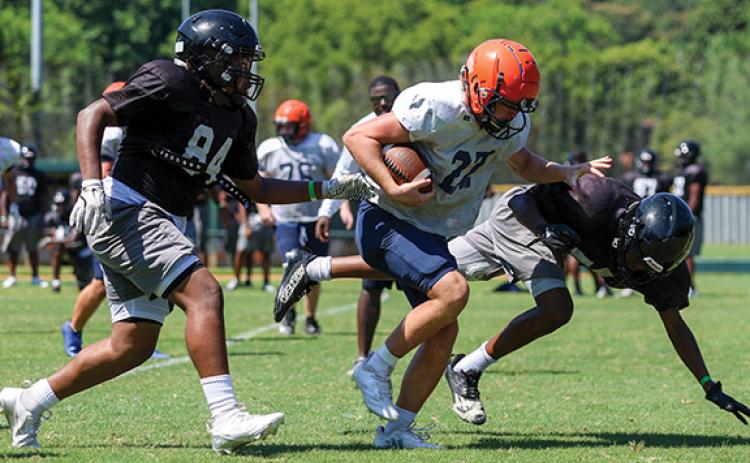 Habersham Central’s Hudson Barnett sheds off a defender during the FCA Team Camp at Piedmont University on Tuesday, July 15. (Landen Todd/Staff)