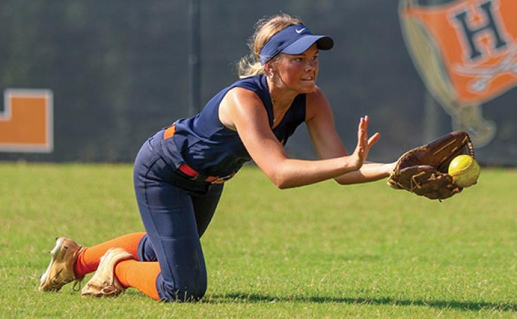Habersham Central’s Kaylan Barrett makes a diving catch during softball practice at Raider Field on Monday, July 7. (Landen Todd/Staff)
