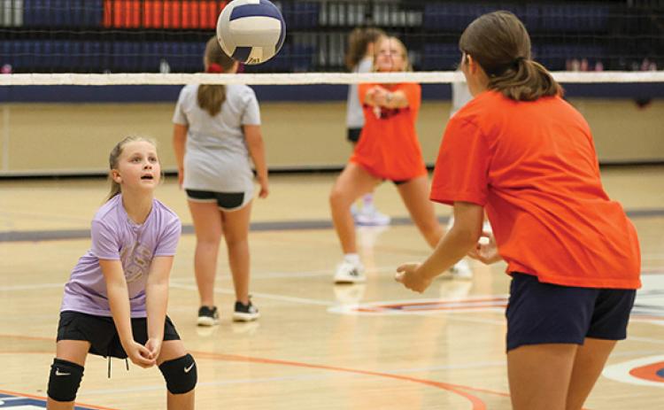 Camper Maleah Laymon practices passing the ball during the volleyball camp at Habersham Central High School on Wednesday, July 9. (Landen Todd/Staff)