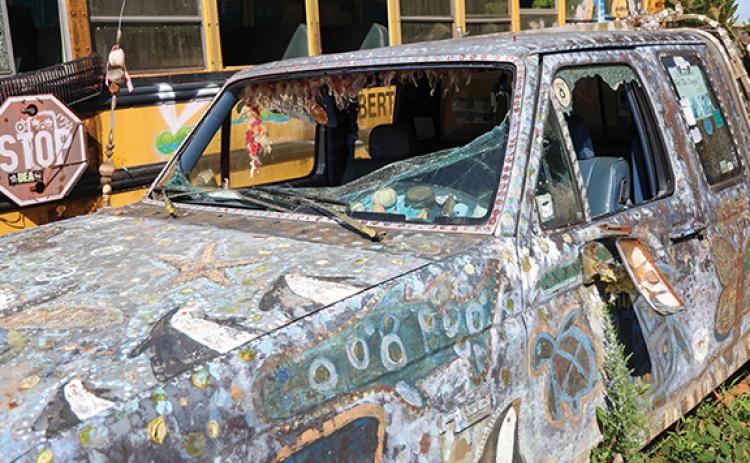 The front windshield and door windows of a vehicle in the School Bus Graveyard has been damaged after a vandalism attempt last Wednesday. (Landen Todd/Staff)