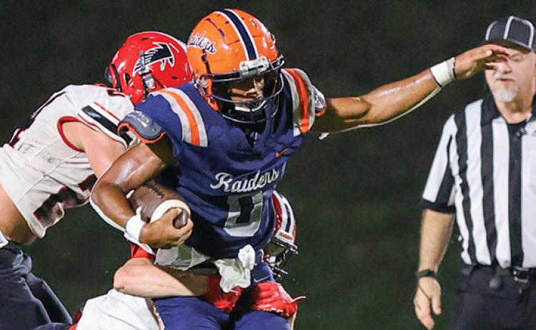 Habersham Central senior running back Donnie Warren (0) breaks through defenders during the game between Flowery Branch and Habersham Central at Raider Stadium on Friday, Aug. 22. The Raiders lost 31-28. (Landen Todd/Staff)