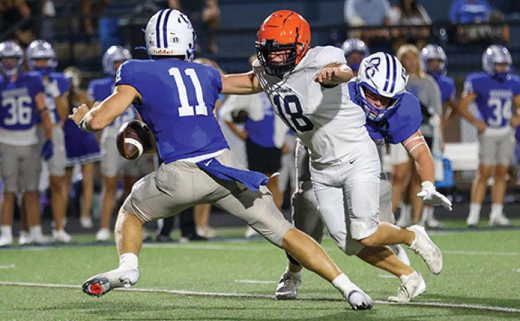 Habersham Central senior Jackson Adams (18) goes after the quarterback during a scrimmage between Habersham Central and Oconee County at Oconee County High School on Friday, Aug. 1. (Landen Todd/Staff)