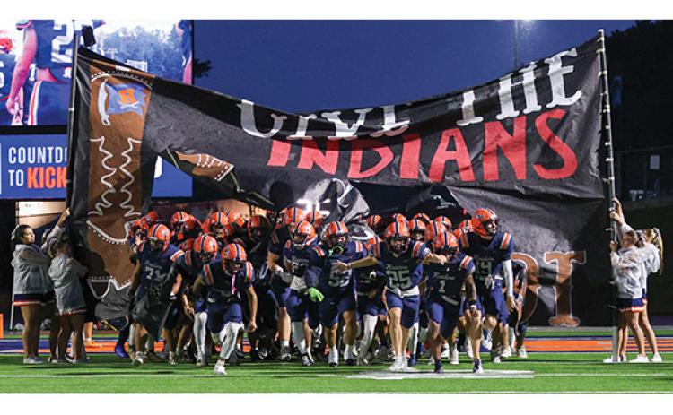 The Raiders storm on the field during the big rivalry opener between Stephens County and Habersham Central at Raider Stadium on Friday, Aug. 15. The Raiders won 27-3. (Landen Todd/Staff)