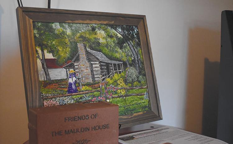 Clarkesville’s Historic Mauldin House and Gardens is working to preserve the city’s history by gathering information, items and funds. Those sharing historical information will be entered into a drawing to win artwork by Frankie Walters, like the piece above. People may also purchase bricks to support the preservation of the property. (Samantha Sinclair/Staff)