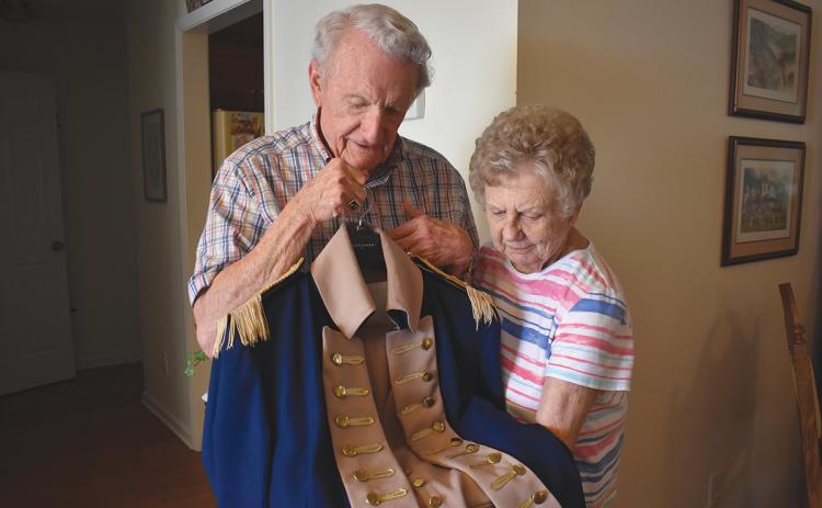 Larry and Evie Whitfield are proud of their Revolutionary War ancestors, and Larry is one of the men known to dress up in a Revolutionary War uniform for events and while serving as a member of the Georgia Sons of the American Revolution Color Guard. His uniform was specially-made by a seamstress in Texas, and he’s taken good care of it over the years. (Samantha Sinclair/Staff)