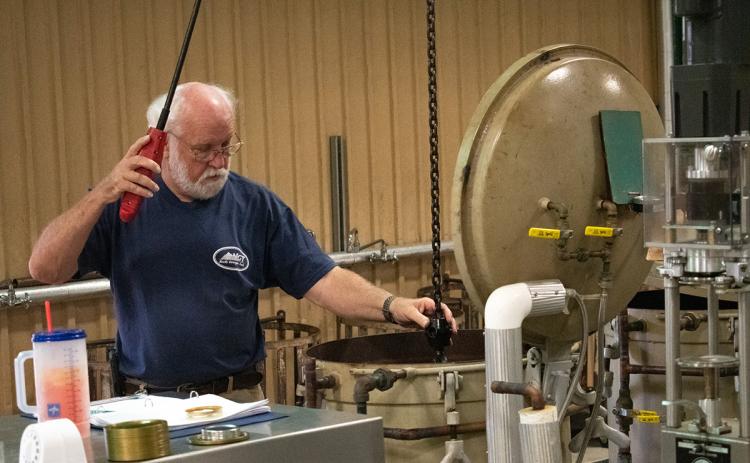 David Barnes helps with the canning process at the Habersham County Canning Plant. Barnes has been working at the canning plant since 1983. (Hannah Caudell/Staff)