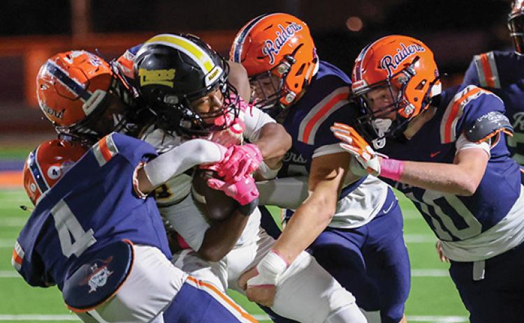 Habersham Central’s defense swarms an Alcovy player during a football game between Alcovy and Habersham Central at Raider Field on Friday, Oct. 10. (Landen Todd/Staff)