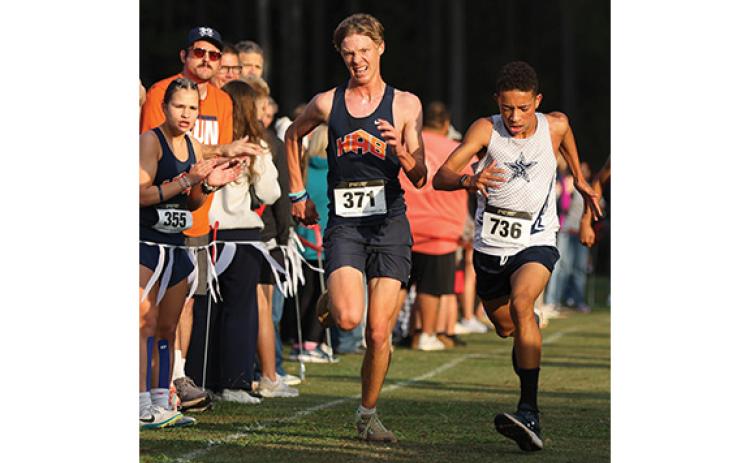 Habersham Central’s Jackson Vonier tries to outrun Ciprian Giamatti during the North Oconee Invitational 2025 on Saturday, Oct. 18. (Landen Todd/Staff)