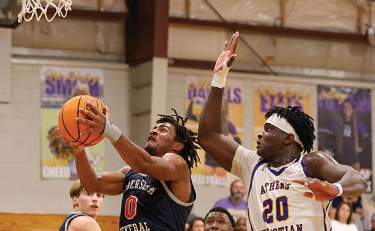 Habersham Central senior guard Donnie Warren (0) goes up for a layup during a basketball game between Habersham Central and Athens Christian at Athens Christian School on Friday, Nov. 21 (Landen Todd/Staff)