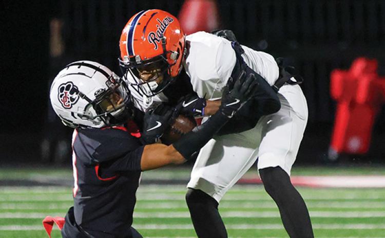 Habersham Central junior wide receiver Jay Feltus (11) tries to shed off Jackson County defender after a catch during a football game between Habersham Central and Jackson County for the region championship at Panther Stadium on Friday, Oct. 31. (Landen Todd/Staff)