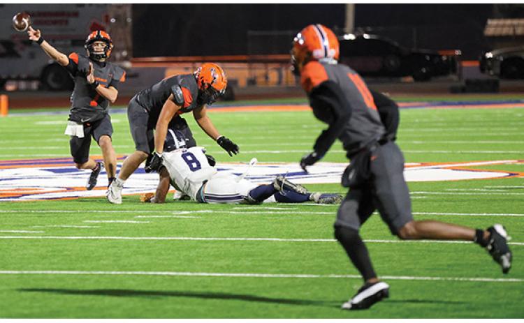 Habersham Central junior quarterback Paris Wilbanks (7) throws the ball to junior wide receiver Jay Feltus (11) during the first round of 5A state playoffs between Statesboro and Habersham Central at Raider Stadium on Friday, Nov. 14. (Landen Todd/Staff)