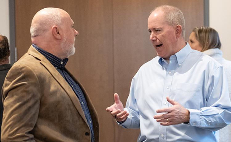 Newly appointed Partnership Habersham Chairman Tommy Thurmond speaks with Tim Ash (left). (Zach Taylor/Staff)
