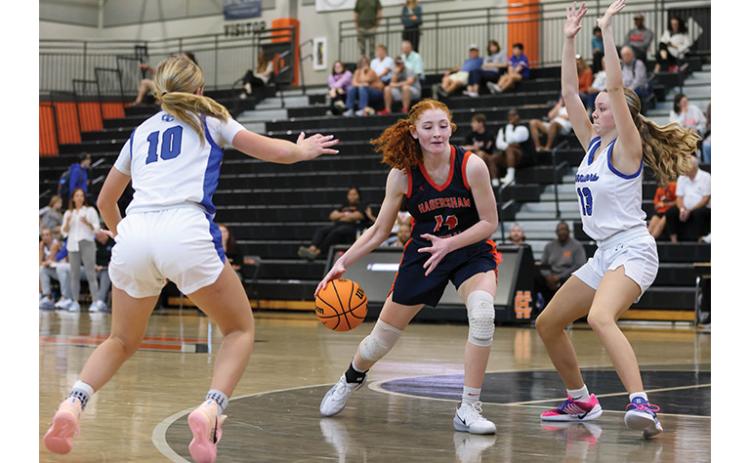 Habersham Central junior Daytona Underwood (14) drives in the paint during the first round of the McDonald’s Shootout Tournament  at Hart County High School on Saturday, Dec. 27. (Landen Todd/Staff)