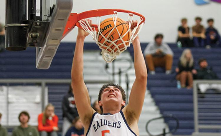 Habersham Central senior forward Jake Mihalick (5) dunks the ball during a basketball game between Rabun Gap-Nacoochee and Habersham Central. (Landen Todd/Staff)