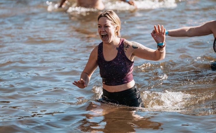 Tiffany Lovell yells out while making her way back to shore. (Zach Taylor/Staff)