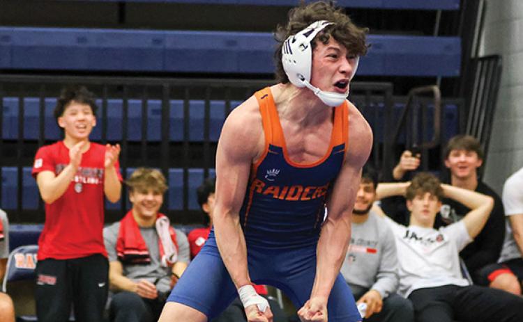 Habersham Central wrestler Christian Saravia celebrates after winning a match against Jackson County during the Region Dual Tournament at the Raider Gymnasium on Saturday Jan. 10. (Landen Todd/Staff)