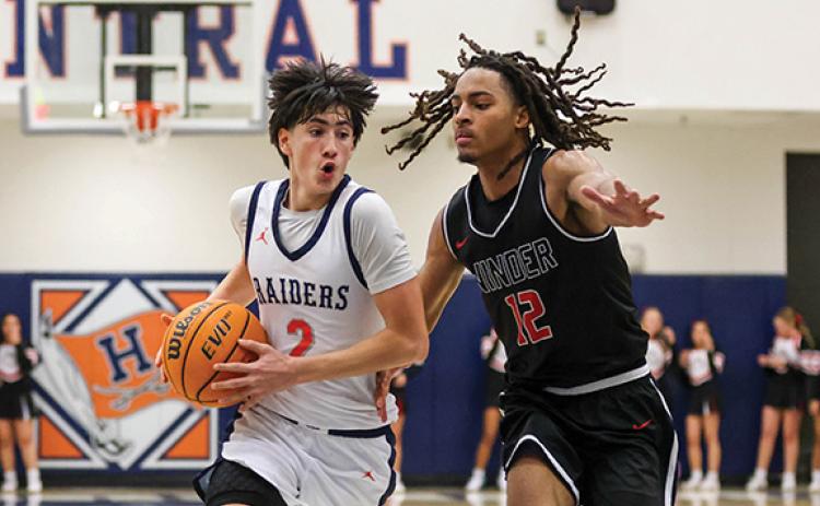 Habersham Central junior guard Eli Maye (2) drives the ball during a basketball game between Winder-Barrow and Habersham Central at the Raider Gymnasium on Friday, Jan. 16. (Landen Todd/Staff)