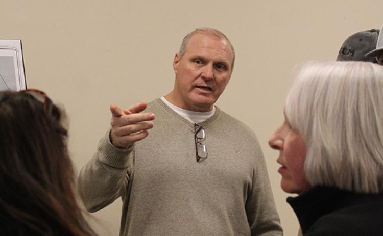 Keith Cook, owner of Cook Construction, explains to community residents and stakeholders details about the potential Duncan Bridge Road project at a town hall last week. (Hannah Caudell/Staff)