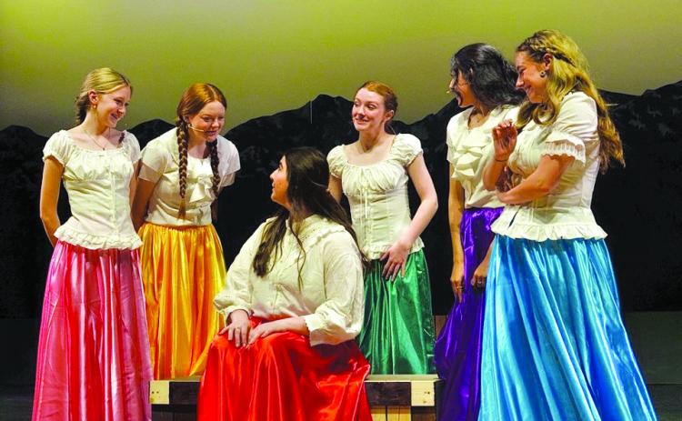 The brides (Sari Elliott, Elloree Chambers, Ashley Jones, Kayla Rummel and Annalee Lewis) gather around Milly played by Aliyah Duncan. (Callie Cueva/Staff)