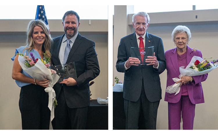 At left, Cornelia Mayor John Borrow poses with his wife, Holly, after being awarded the Distinguished Citizen Award. At right, Larry and Evie Whitfield pose after Larry received the Distinguished Citizen Award. (Zach Taylor/Staff)