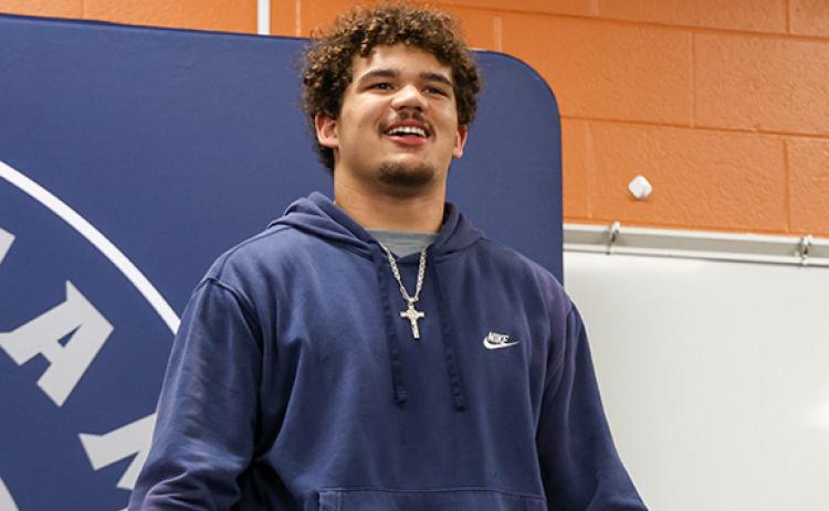 Habersham Central senior offensive lineman and wrestler Javonte Bowen gives a speech at his signing ceremony at Habersham Central High School on Wednesday, Feb. 18. (Landen Todd/Staff)
