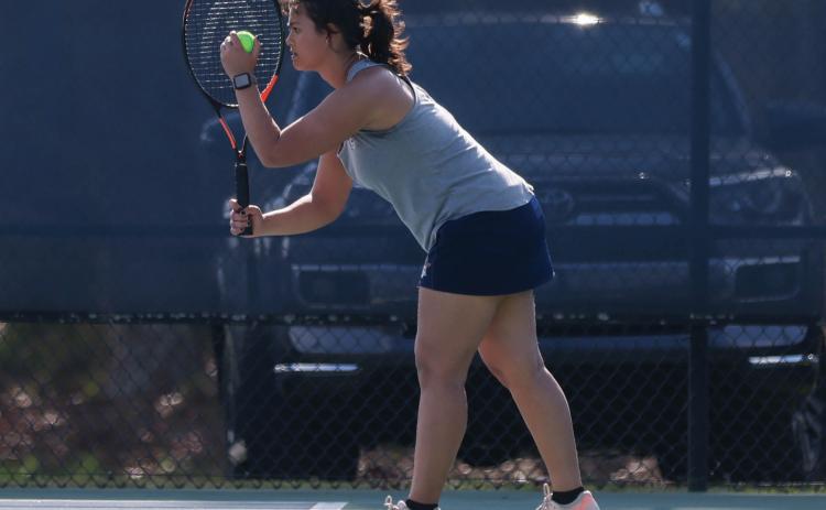 Habersham Central senior Zaelice Phasavang prepares to serve the ball during a match between Jackson County and Habersham Central at Habersham Central High School on Thursday, March 26. (Landen Todd/Staff)