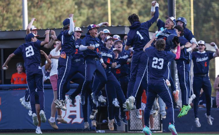 Habersham Central senior infielder Carter Crane (1) celebrates a home run with the team during a baseball game between Apalachee and Habersham Central at Raider Park on Friday, March 27. (Landen Todd/Staff)
