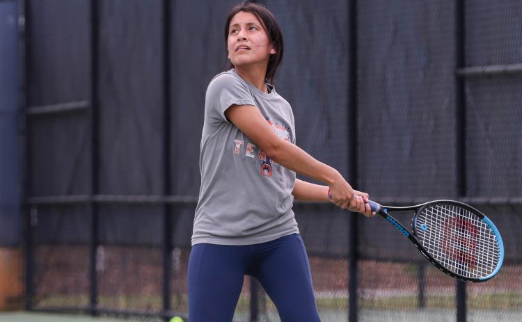 Habersham Central junior tennis player Kailey Otero hits the ball during a region tournament match-up between Apalachee and Habersham Central at Habersham Central High School on Monday, March 30. (Landen Todd/Staff)
