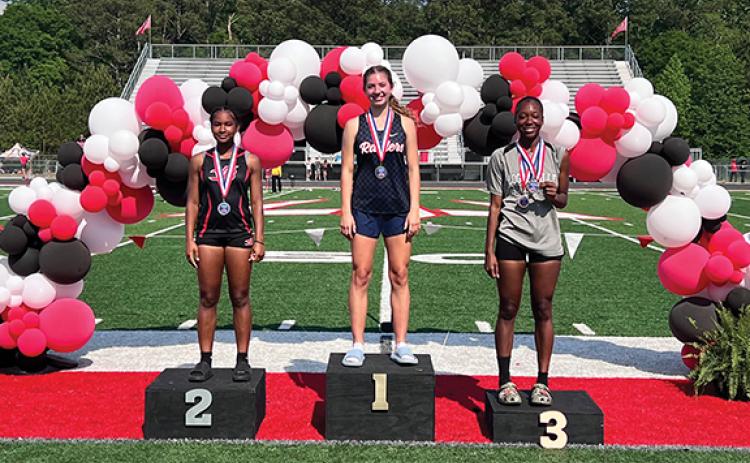 Sadie Chambers, center, was the region champion in the girls high jump at Loganville High School in the region track meet on Thursday, April 23. (Submitted)