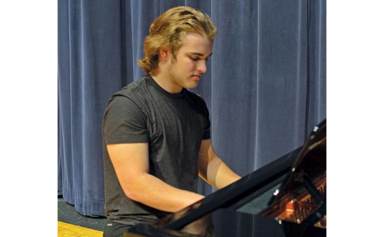 Terrell Miller of The Blue Room Boys plays the piano. (Callie Cueva/Staff)