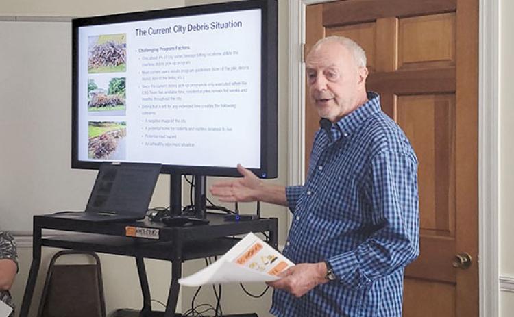 Clarkesville Councilman Brad Coppedge shows the challenges the debris pickup program faces during a presentation to council at its work session Tuesday night. (Samantha Sinclair/Staff)