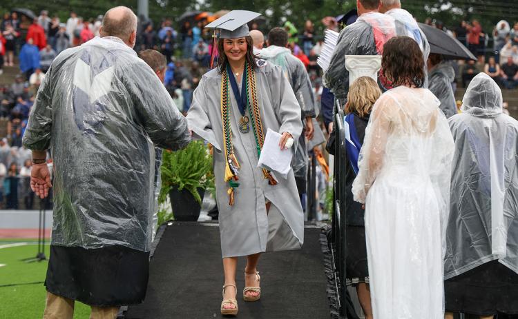 HCHS graduate Rainlan Hobson walks off the stage after receiving her diploma at Raider Stadium Friday, May 22. (Landen Todd/Staff)