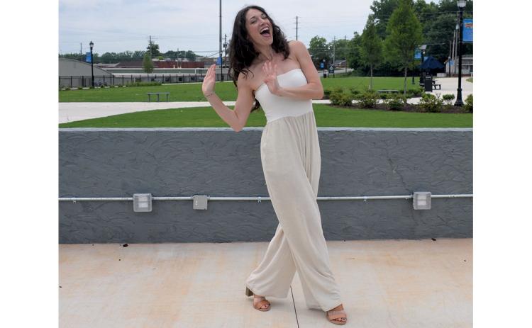 Amber Watson of Smudged Academy practices dance moves in Donald Anderson Park where she and Sheila Humphrey will lead a 100 Years of Dance warm-up Saturday morning. (Samantha Sinclair/Staff)