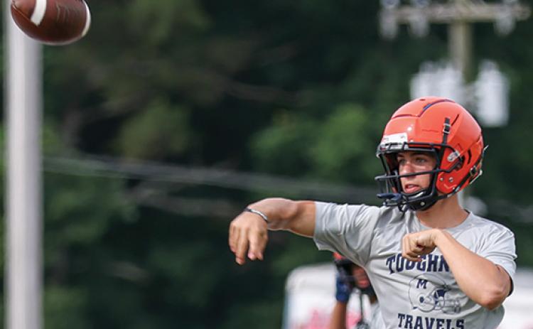 Habersham Central rising junior Trent Muenzer makes a jumping throw during a football practice at Raider Stadium on Monday, June 8. (Landen Todd/Staff)