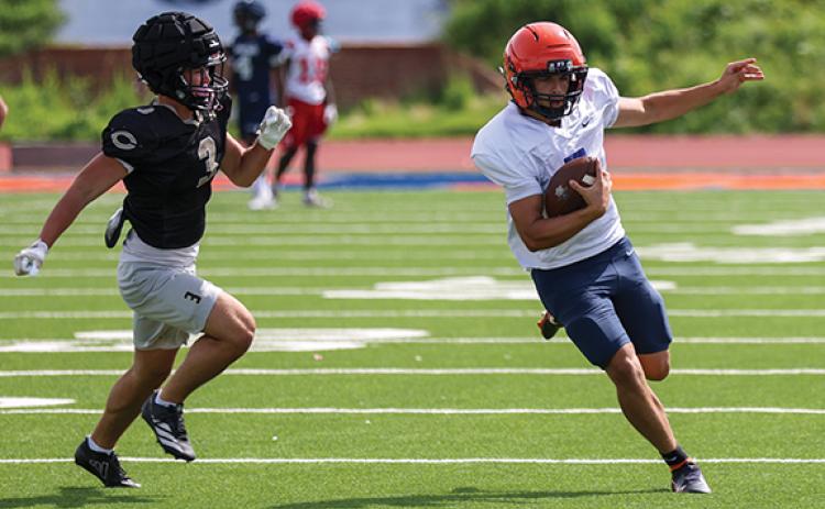 Habersham Central rising senior quarterback Paris Wilbanks (7) makes a big time run during a scrimmage at Raider Stadium on Wednesday, June 24. (Landen Todd/Staff)